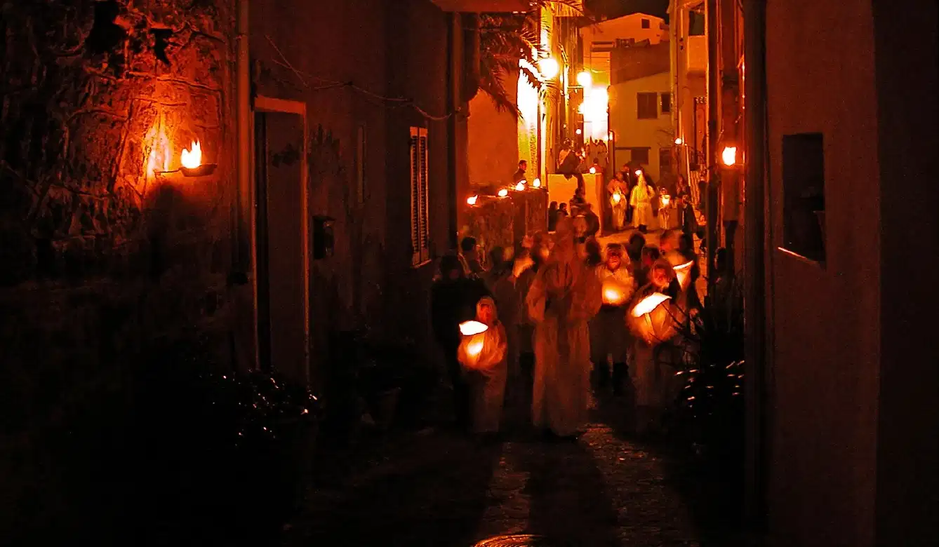 Holy Week Photo Experience in Castelsardo, Sardinia with Lunissanti torchlit procession and chants.