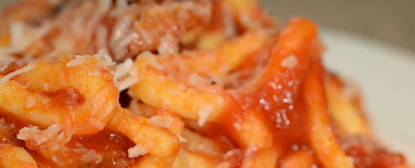 Dining Experience in Rome: Taste Nonna-style home food & family stories in a tiny market kitchen.