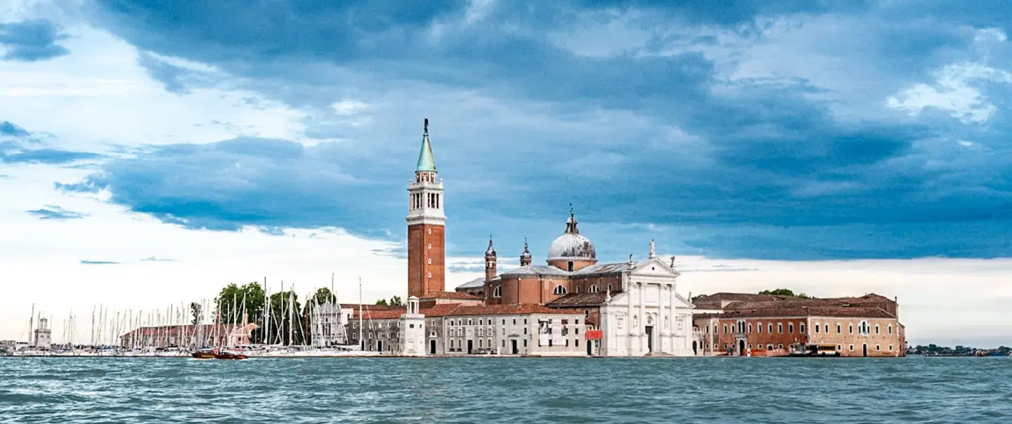 Boat Tour in Venice, savoring the timeless beauty of the city and its surrounding islands at sunset.
