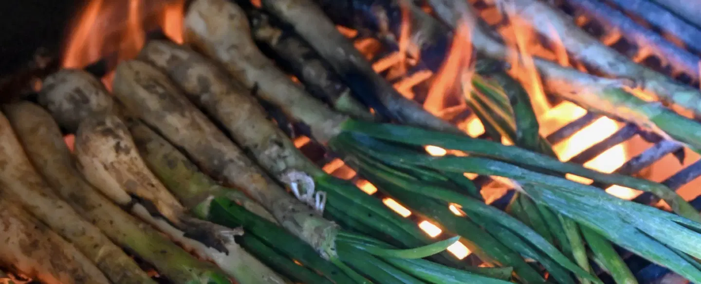 Seasonal Food Tour from Barcelona with countryside calçot feast & Santes Creus Monastery visit.