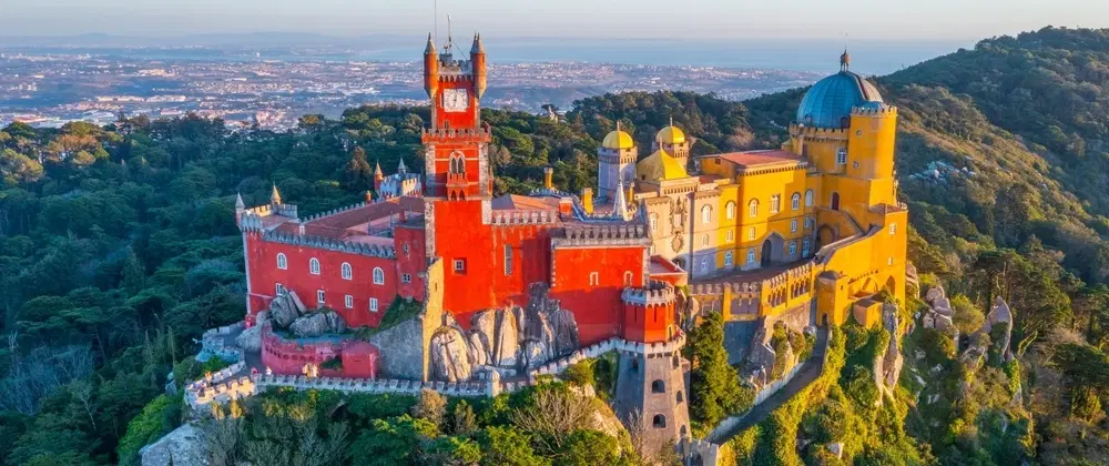 Day Trip from Lisbon to Sintra with pre-opening Pena Palace access and scenic Azenhas do Mar lunch.