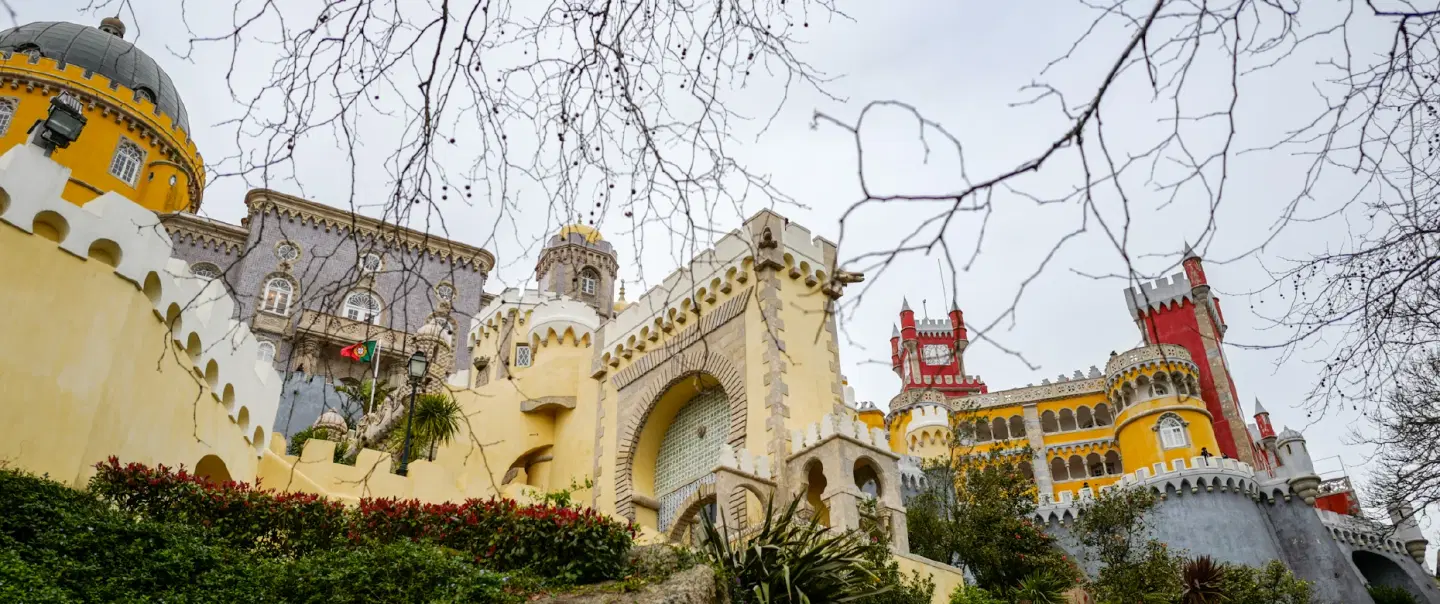 Day Trip from Lisbon to Sintra with pre-opening Pena Palace access and scenic Azenhas do Mar lunch.