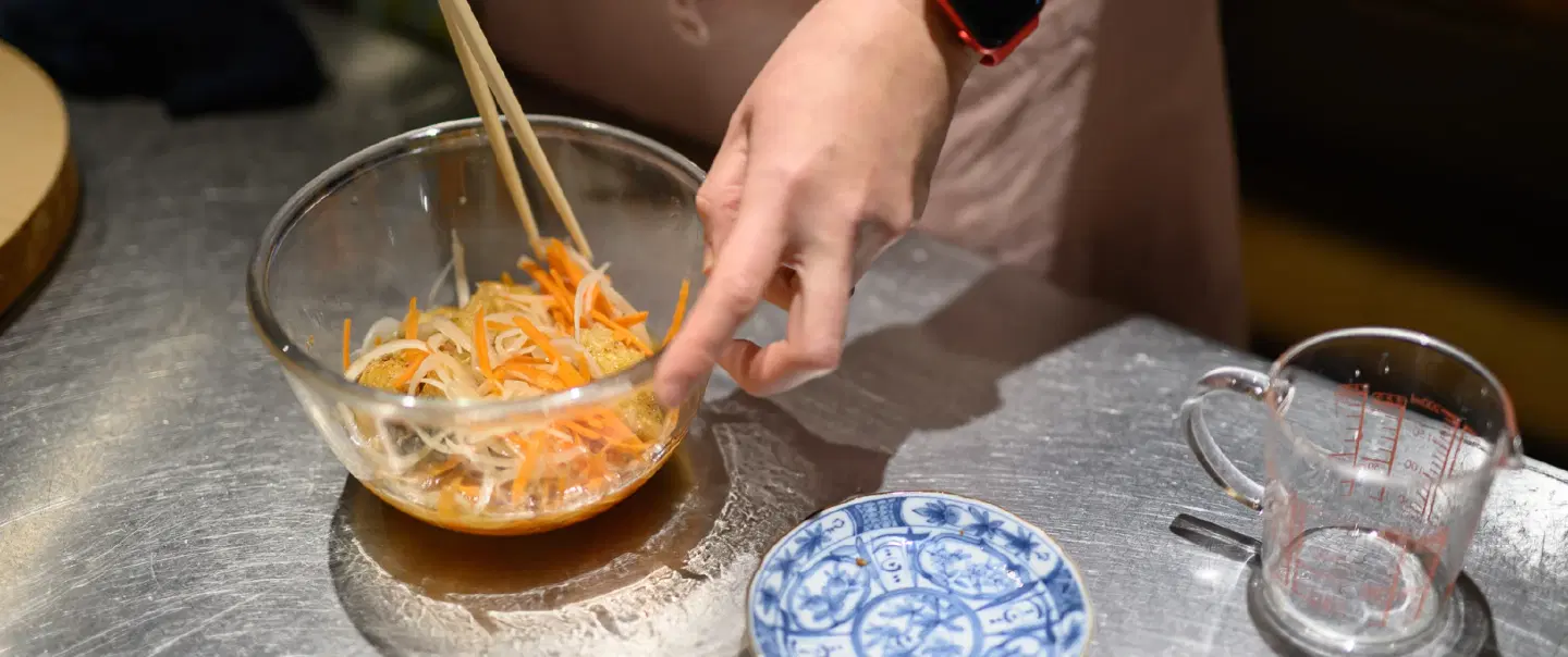 Cooking Demonstration in Kyoto with seasonal home cooking and sake pairings in a historic shop.