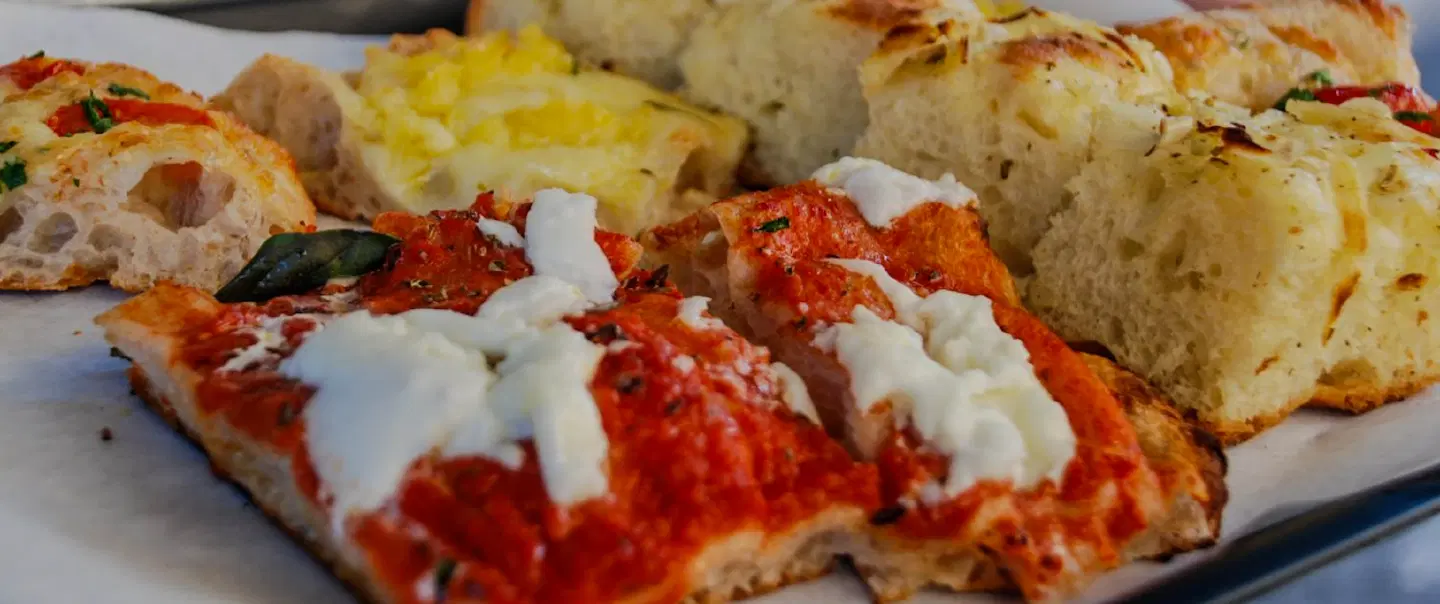 Food Tour in Rome, tasting coffee, pizza, and local treats while exploring the historic center.
