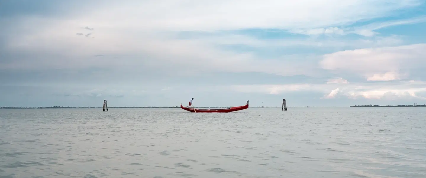 Boat Tour in Venice, savoring the timeless beauty of the city and its surrounding islands at sunset.