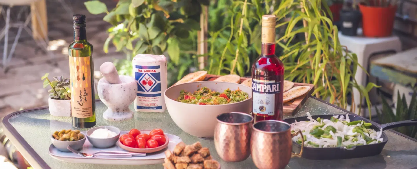 Argentinian Family-style Asado in a local home in Mendoza with food shopping, grilling, and wine.