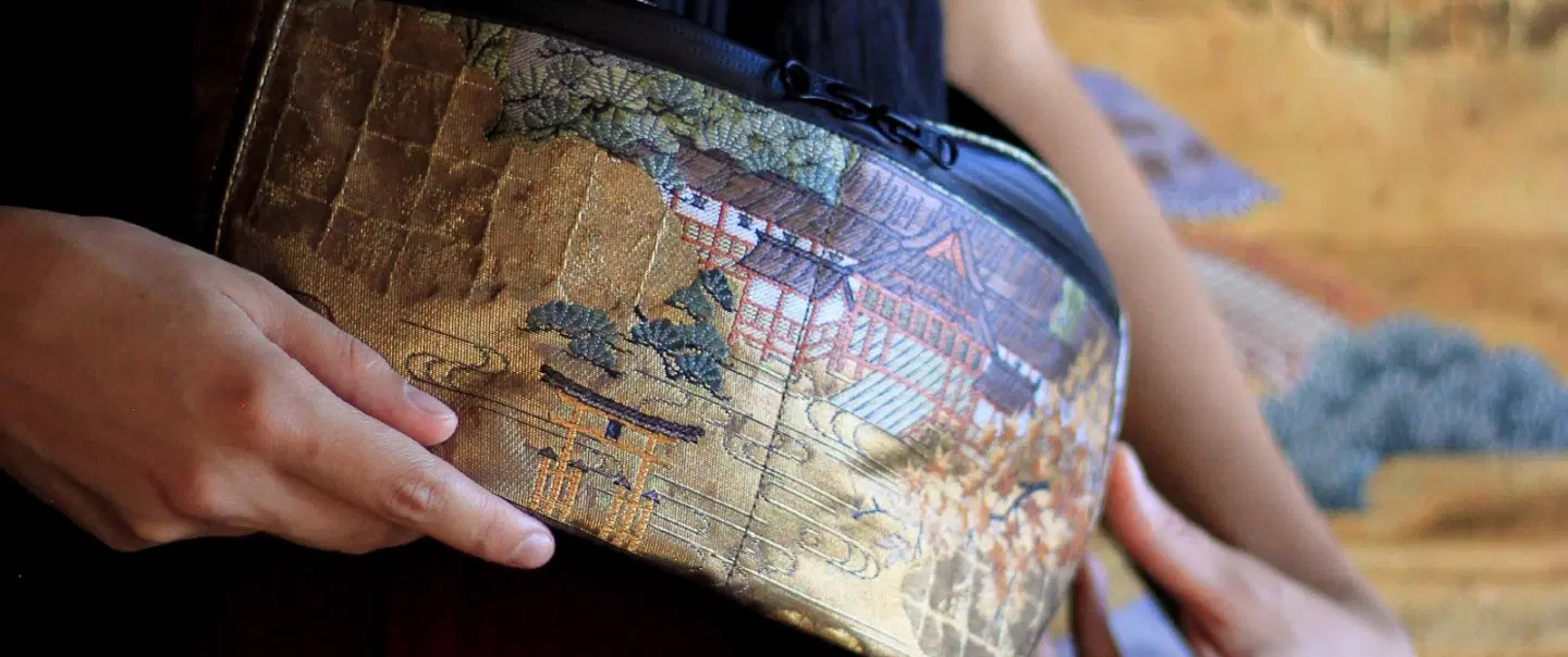 Craft Workshop in Kyoto exploring kimono obi, vintage textiles, and a handmade upcycled pouch.