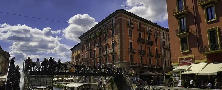 Photo Walk along Milan's Navigli, capturing reflections, bridges & the rhythm of evening canal life.