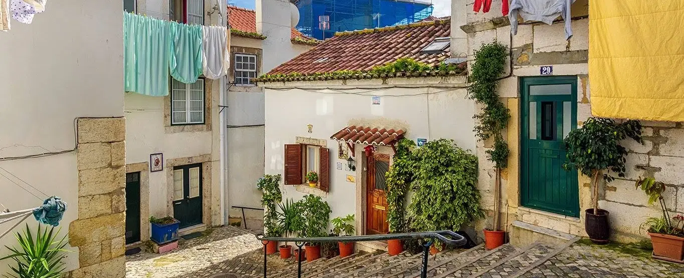 Walking Tour in Lisbon through Alfama and Mouraria tracing the city’s layered civilizations.