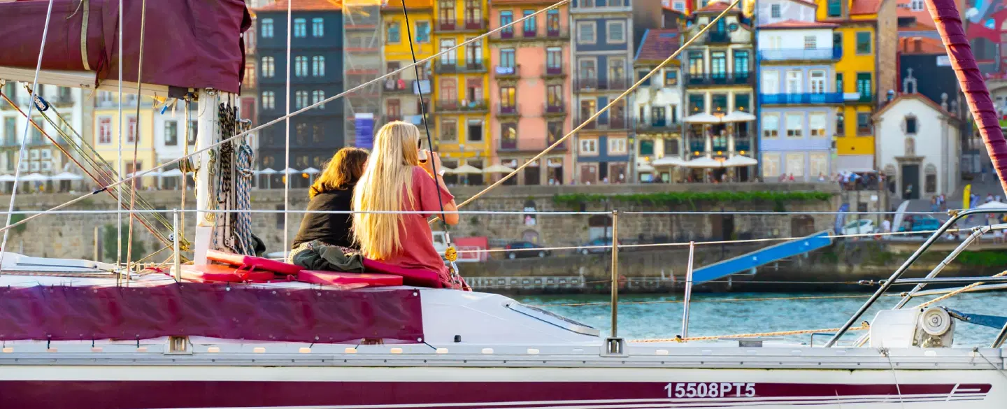 Boat Tour in Porto, Portugal: Glide on the Douro River, taste Port wine, and enjoy a sardine lunch. 