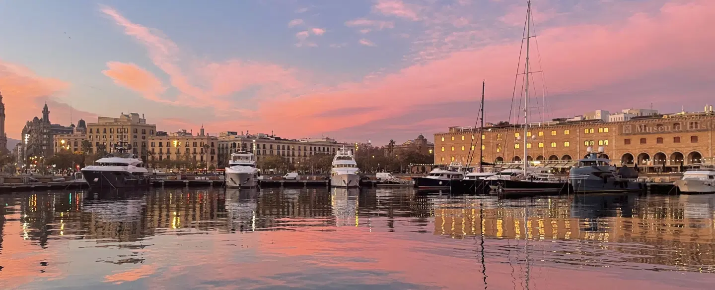 Boat tour on a catamaran at sunset in Barcelona with wine, coastal views, and local stories. 