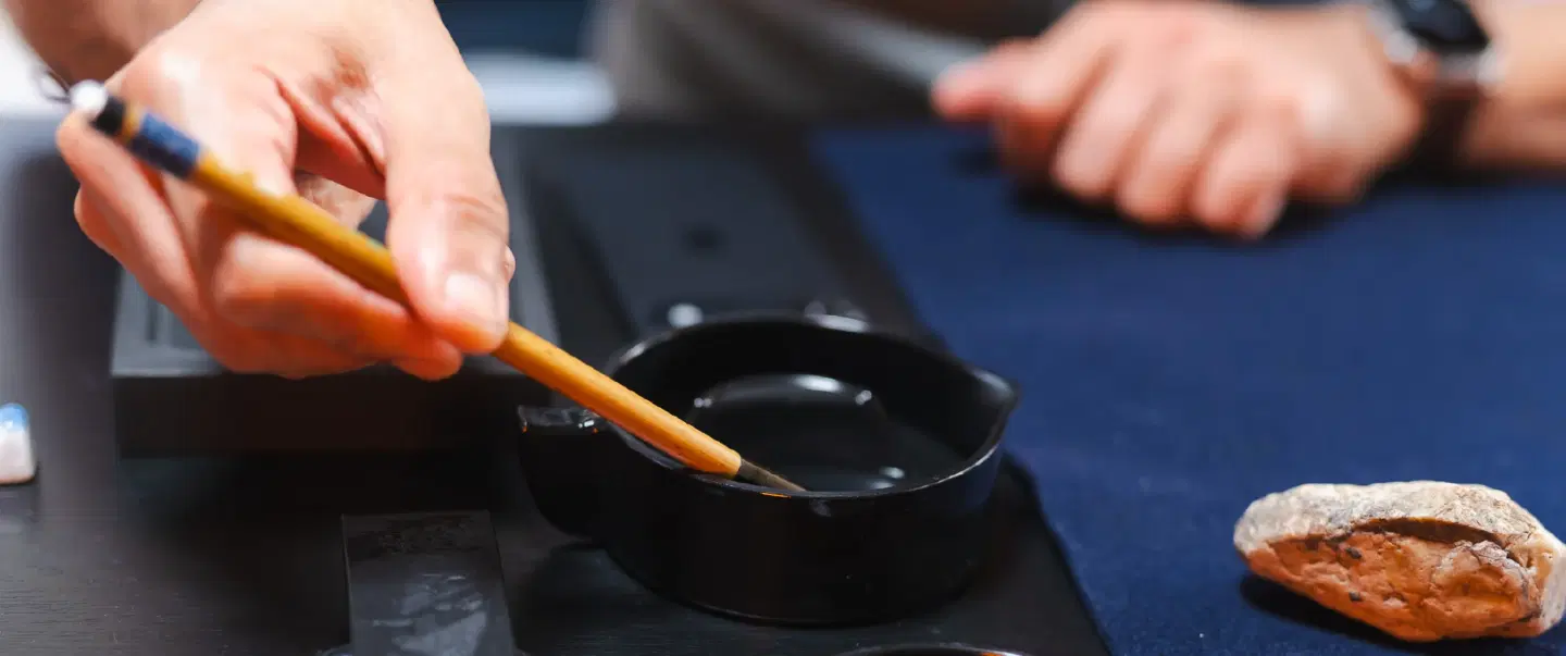 Craft and Culture Workshop in Kyoto held in a temple exploring the world of Japanese Calligraphy.