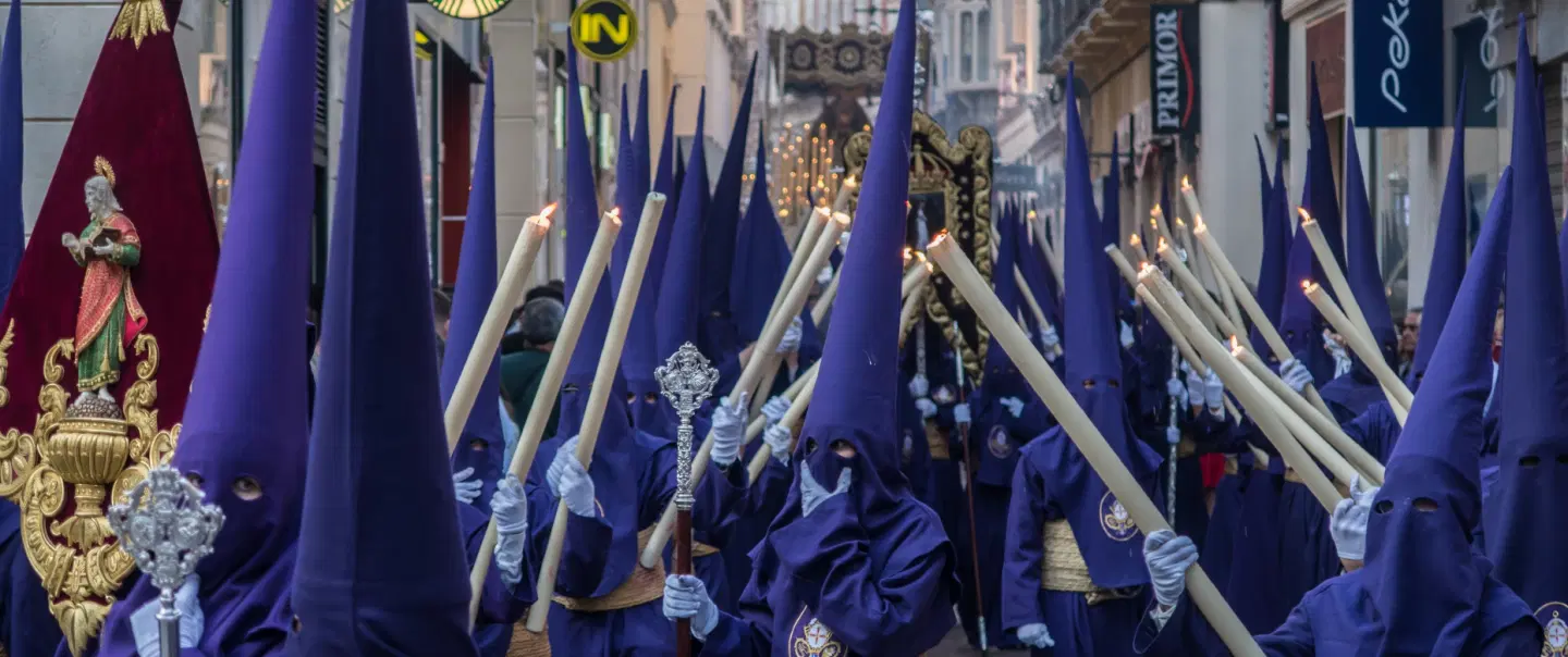Holy Week Tour in Málaga: witness Semana Santa procession on private balcony with cultural insights.
