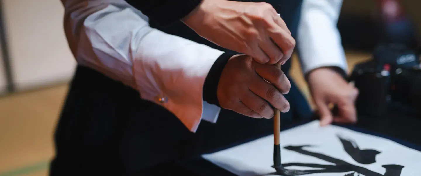 Craft and Culture Workshop in Kyoto held in a temple exploring the world of Japanese Calligraphy.