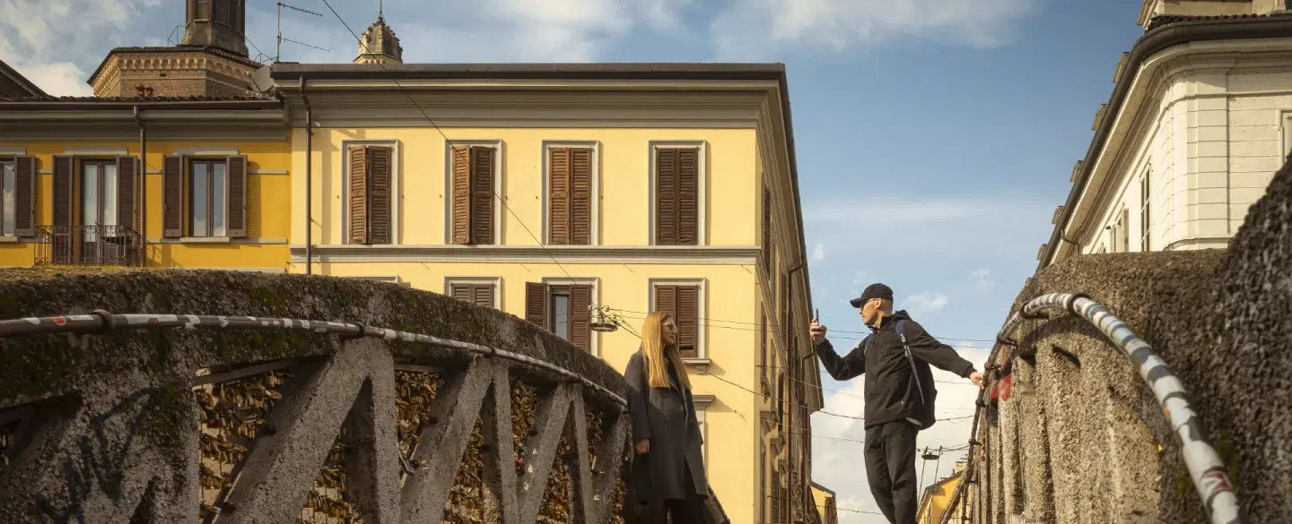 Photo Walk along Milan's Navigli, capturing reflections, bridges & the rhythm of evening canal life.