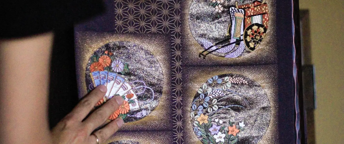 Craft Workshop in Kyoto exploring kimono obi, vintage textiles, and a handmade upcycled pouch.