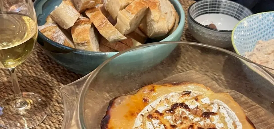 French Wine & Cheese Tasting in Paris: curated regional pairings with a chef in his home kitchen.