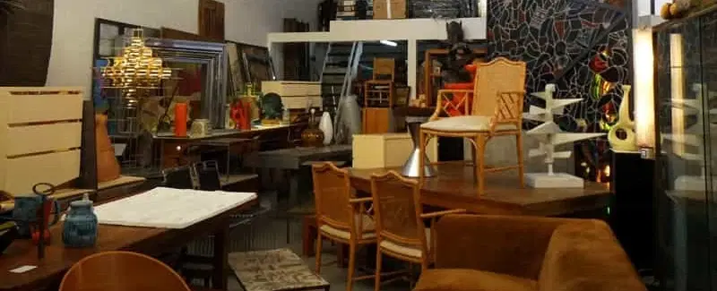 Antiques Tour in Paris walking through Saint-Ouen Flea Markets with insider access to key dealers.