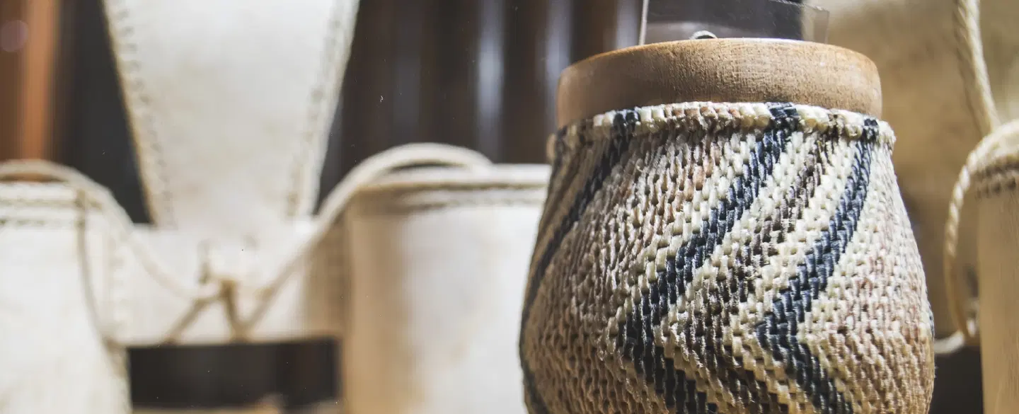 Cultural Walking & Shopping Tour in Mendoza artisan market handling gaucho items & handmade crafts.
