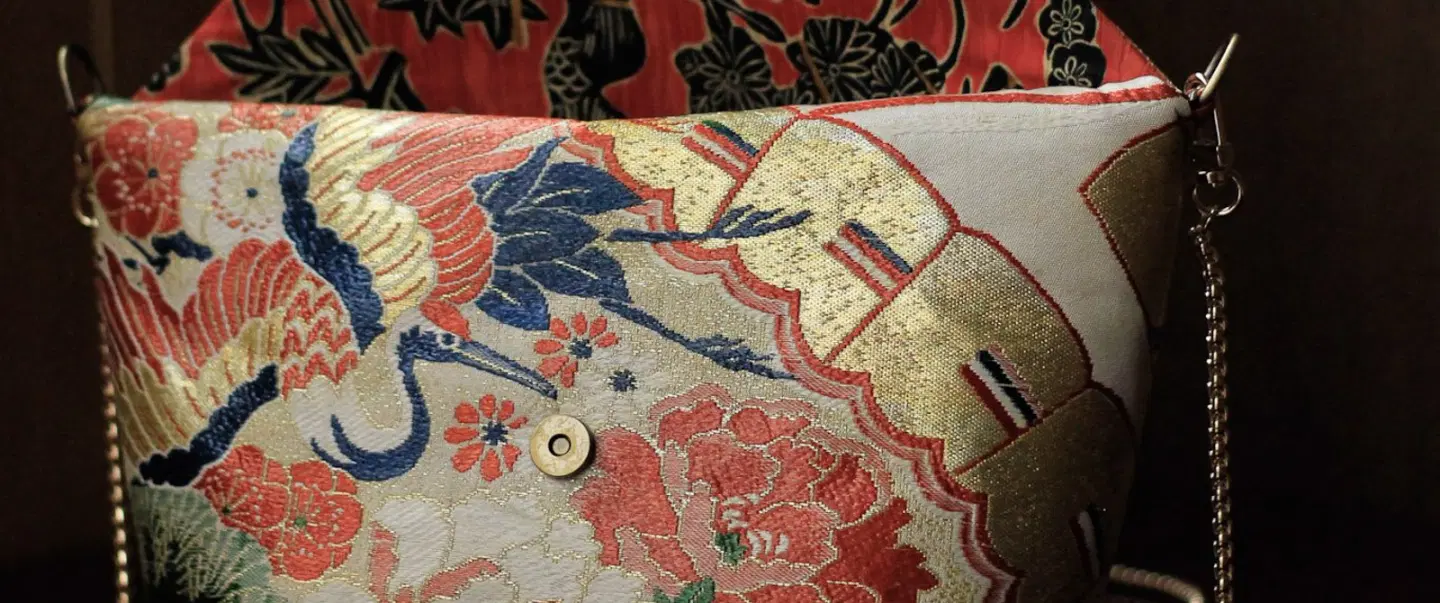Craft Workshop in Kyoto exploring kimono obi, vintage textiles, and a handmade upcycled pouch.