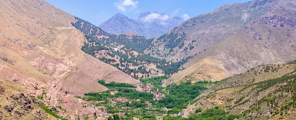 Hiking Trek past Berber villages and mountain passes of Atlas Mountains from Imlil near Marrakesh.
