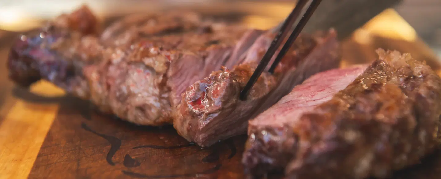 Argentinian Family-style Asado in a local home in Mendoza with food shopping, grilling, and wine.