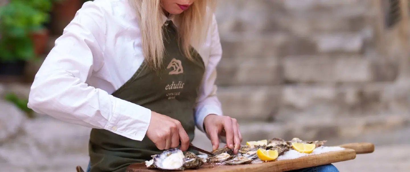 Walking Food Tour in Dubrovnik exploring social history, traditional dishes and local wine pairings.