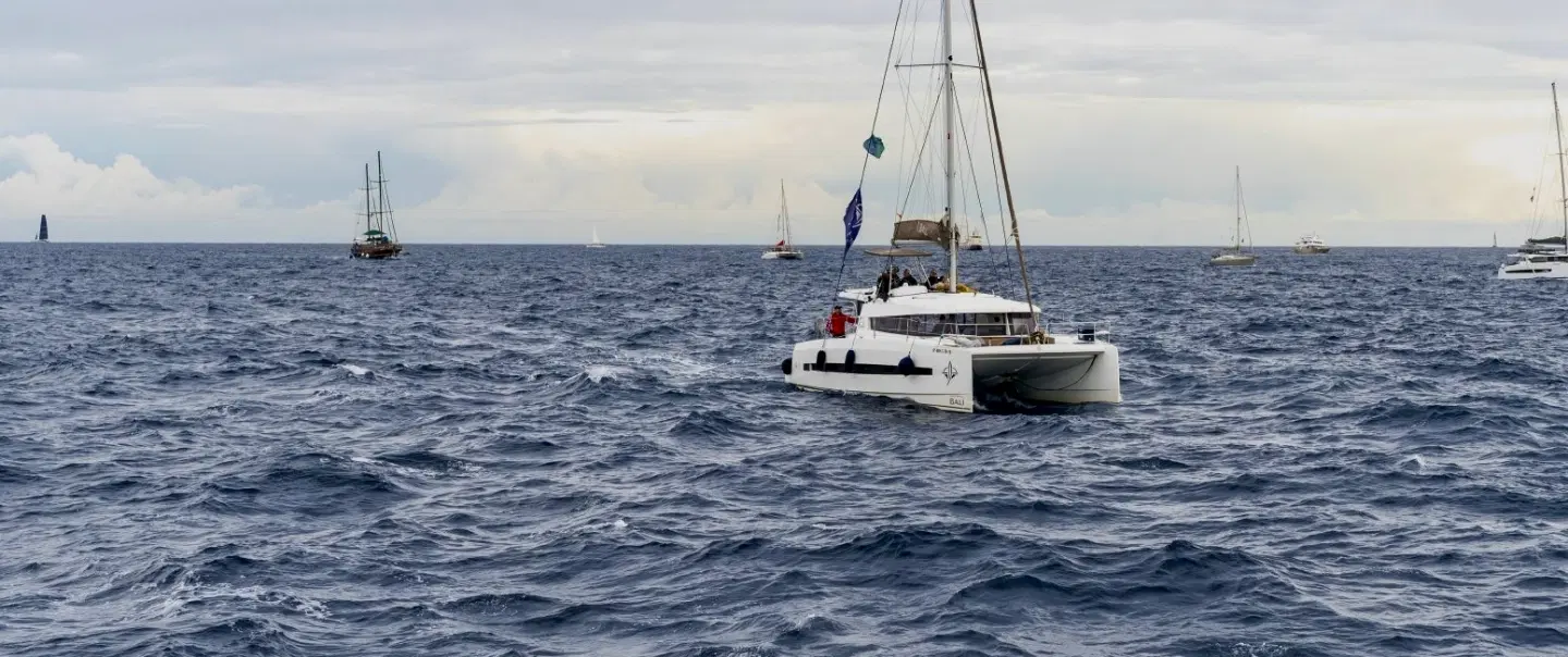 Boat Tour in Barcelona in a luxury catamaran, cook paella onboard, and share a long Catalan lunch.