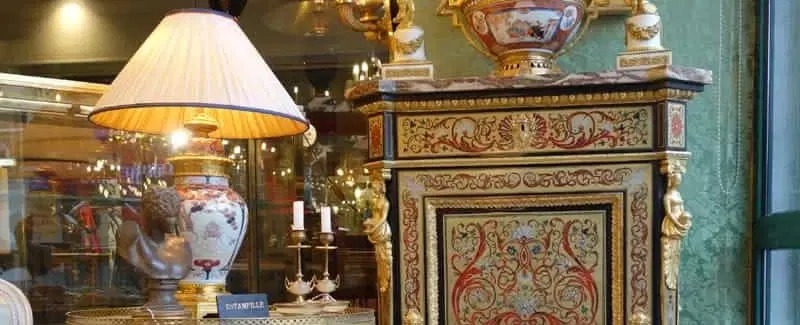 Antiques Tour in Paris walking through Saint-Ouen Flea Markets with insider access to key dealers.