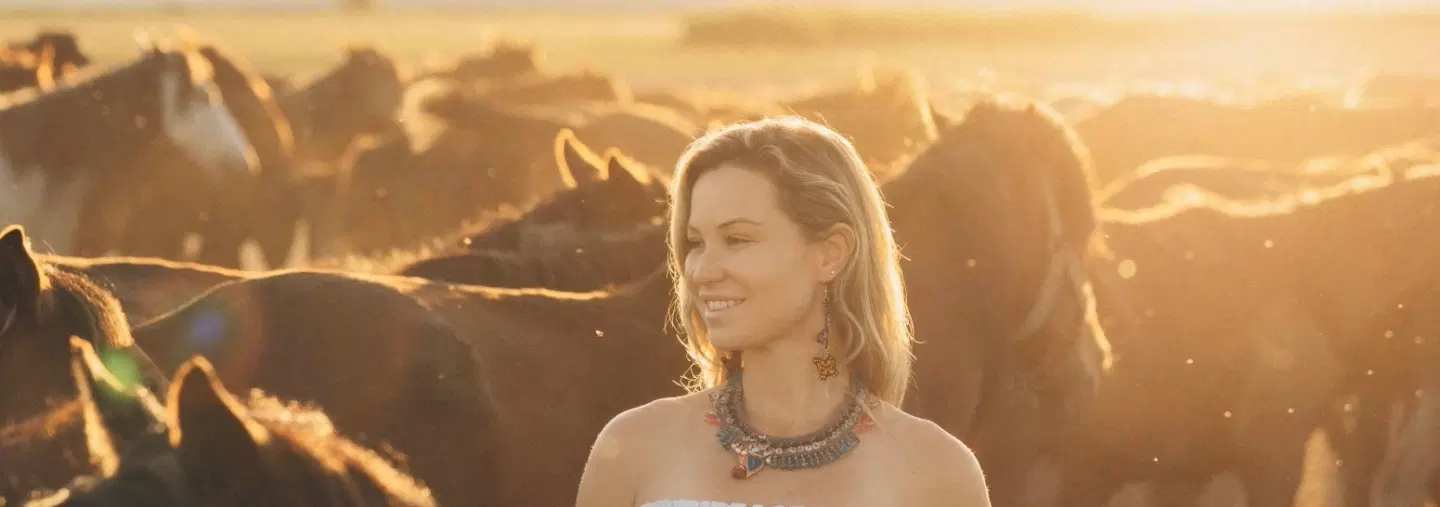 Sunset portrait photoshoot in Cappadocia with galloping wild Yılkı horses and expert photographer.
