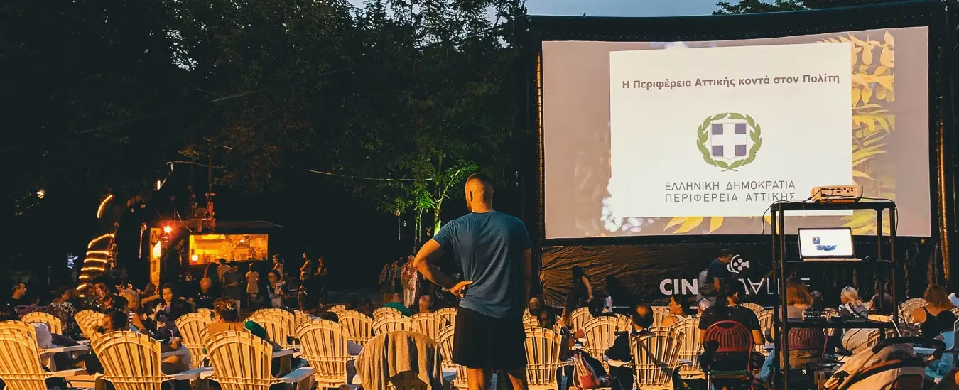 Walking Tour in Athens with cultural storytelling, a Greek home-cooked dinner and open-air cinema.