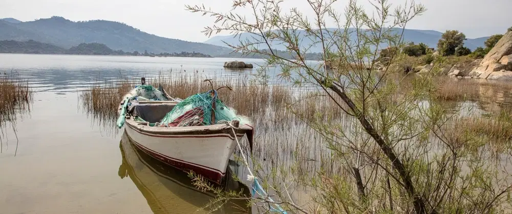 Day Trip from Bodrum exploring Lake Bafa, Heraclea ruins, island chapels, seafood, and olive oil.