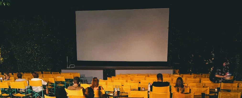 Walking Tour in Athens with cultural storytelling, a Greek home-cooked dinner and open-air cinema.