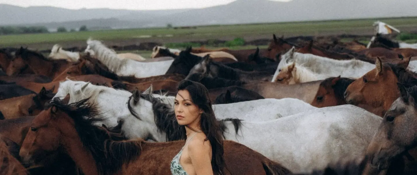 Sunset portrait photoshoot in Cappadocia with galloping wild Yılkı horses and expert photographer.
