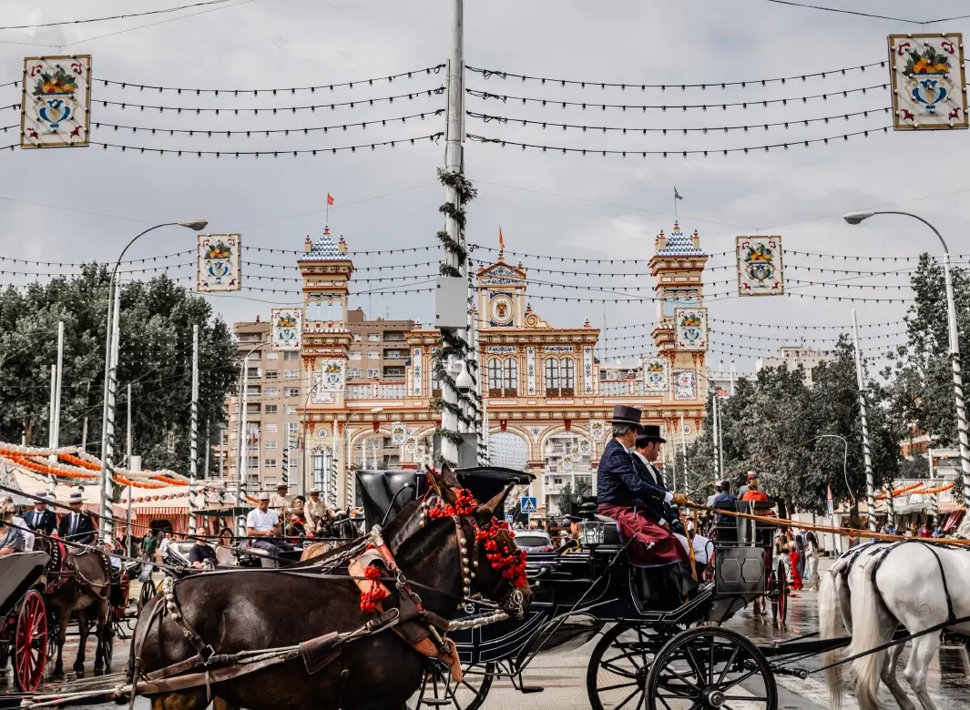 Feria de Abril Tour in Seville: dance class, flamenco styling, carriage ride, private caseta access.
