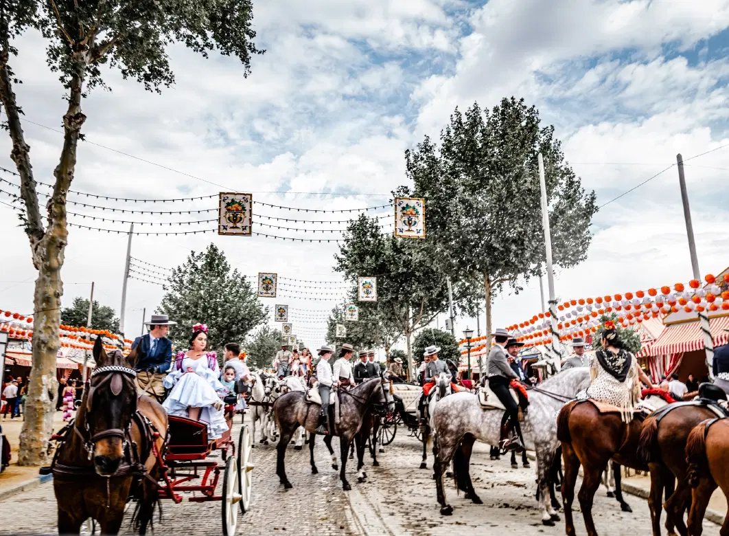 Feria de Abril Tour in Seville: dance class, flamenco styling, carriage ride, private caseta access.