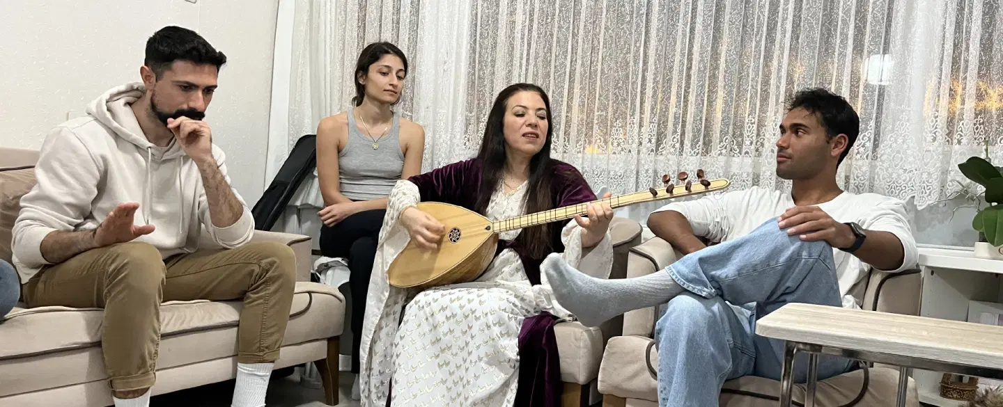 Kurdish Dengbej storytelling and home-cooked dinner in a local Istanbul home with traditional music.