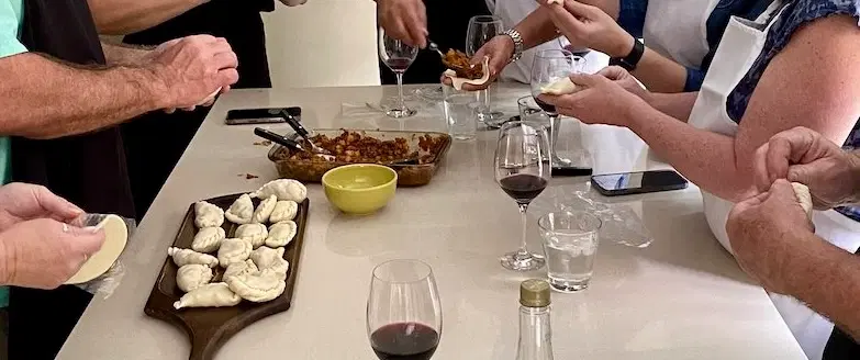 Cooking Class in Buenos Aires making Argentine empanadas in a local home, with wine and dessert.