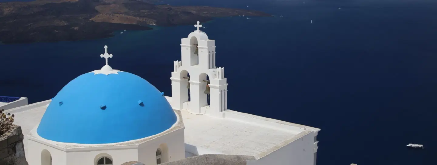 Island Tour in Santorini with morning sightseeing and a private sunset cruise along the caldera.