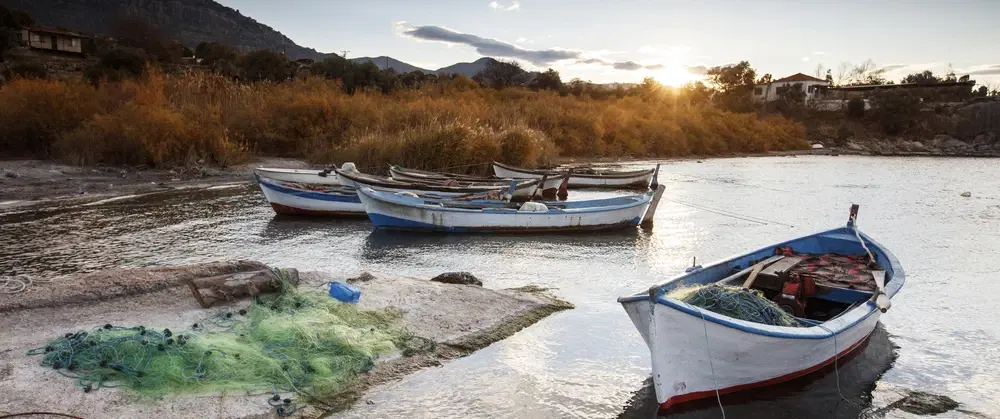 Day Trip from Bodrum exploring Lake Bafa, Heraclea ruins, island chapels, seafood, and olive oil.