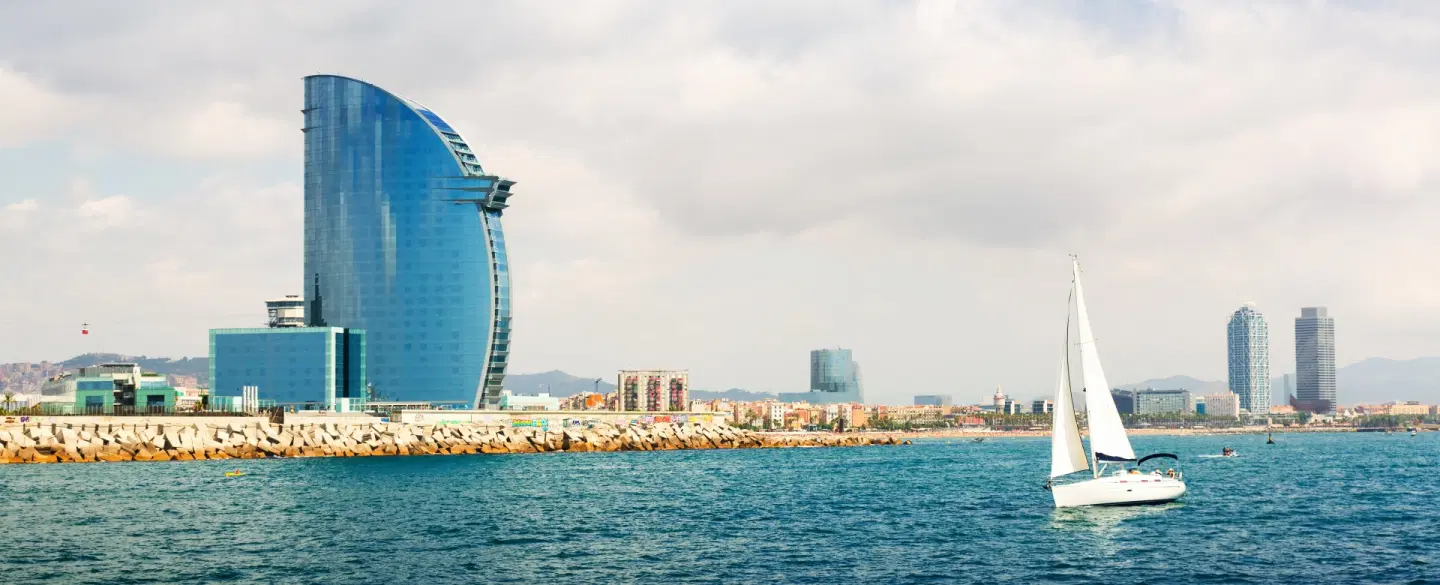 Boat Tour in Barcelona in a luxury catamaran, cook paella onboard, and share a long Catalan lunch.