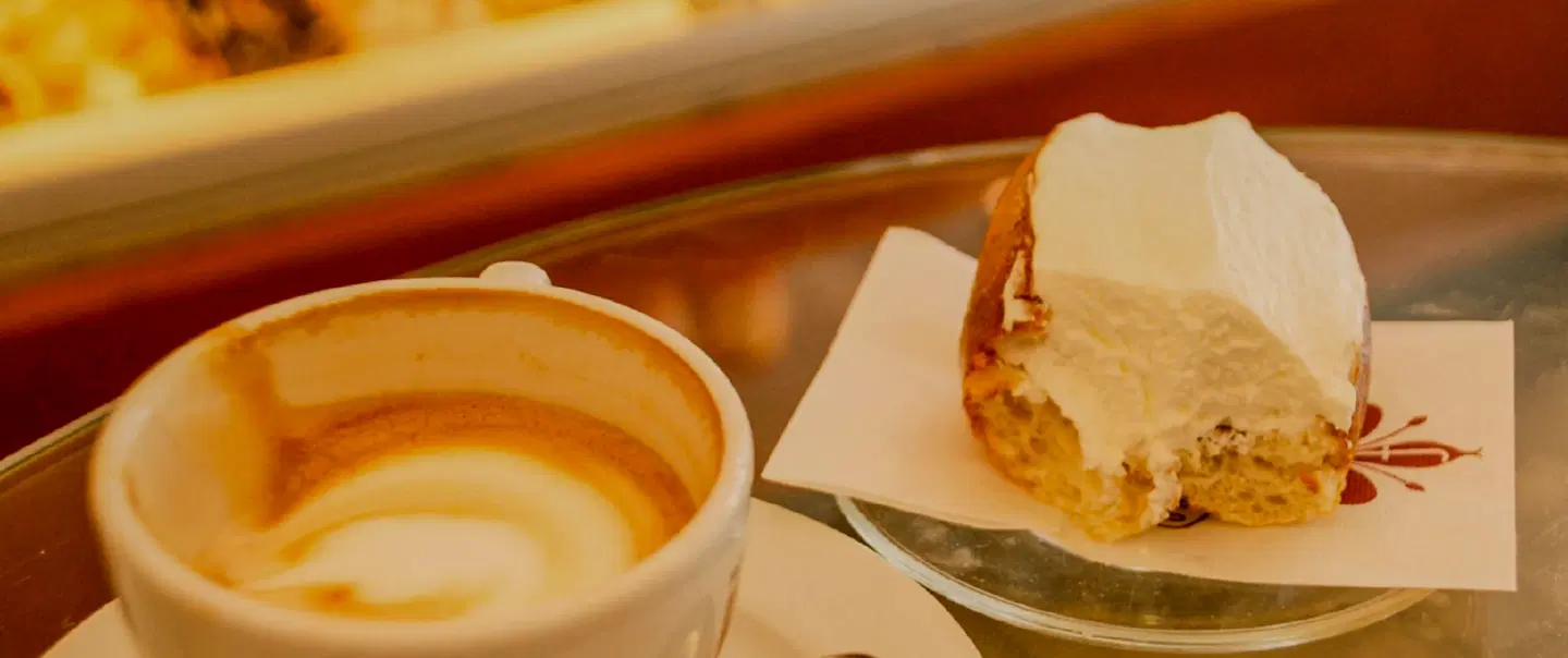 Food Tour in Rome, tasting coffee, pizza, and local treats while exploring the historic center.