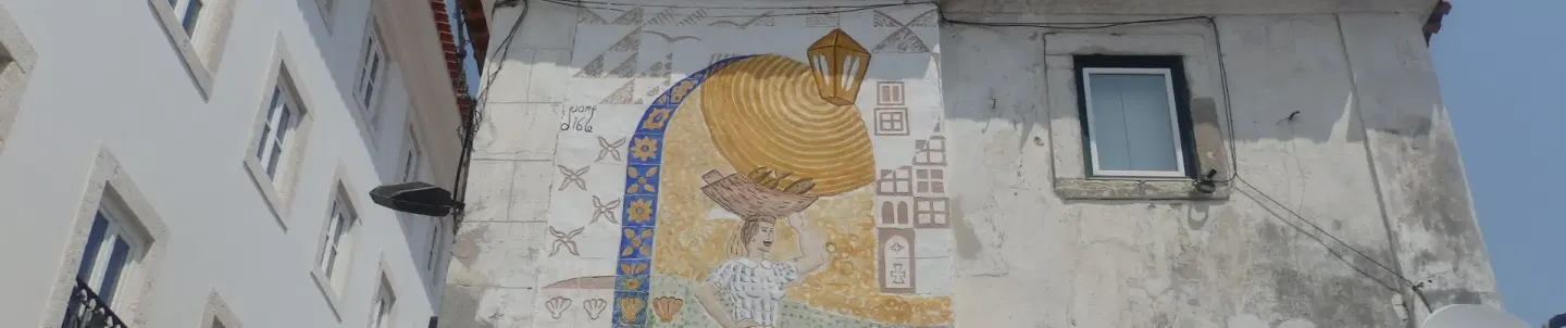 Photo Walking Tour in Alfama, Lisbon, exploring silent alleys, hidden viewpoints, and local haunts.