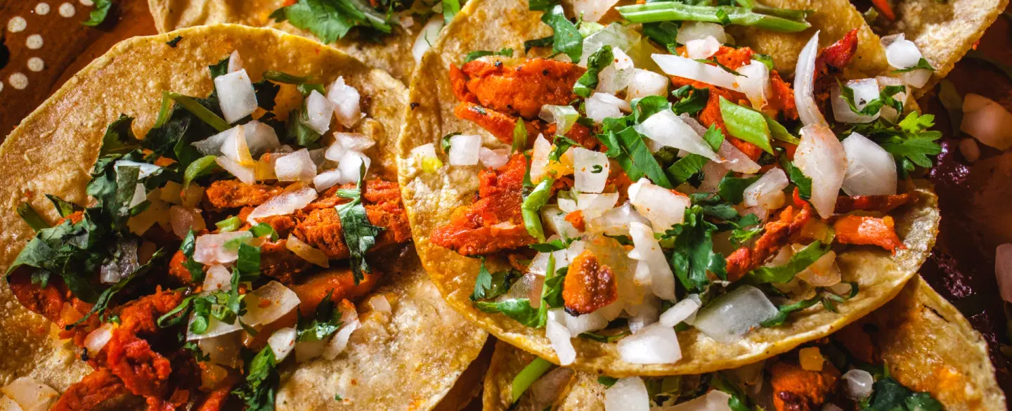 Photoshoot and Walking Tour of Mexico City’s La Ciudadela artisan market with tacos and crafts.