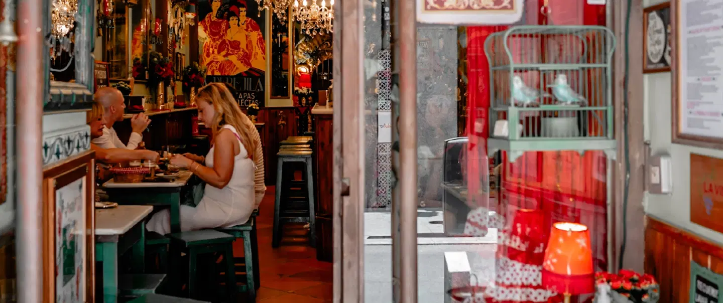 Nightlife Tour in Madrid's Chueca & Malasaña with tapas, wine, history, and local cultural insights.