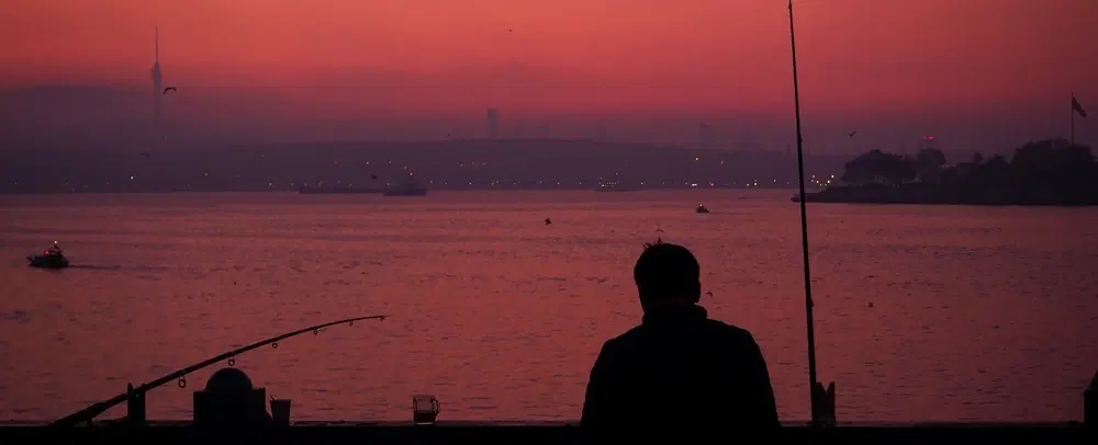 Sunrise Photo Walk in Istanbul: Galata Bridge, blue hour to golden hour, Bosphorus views, fishermen.