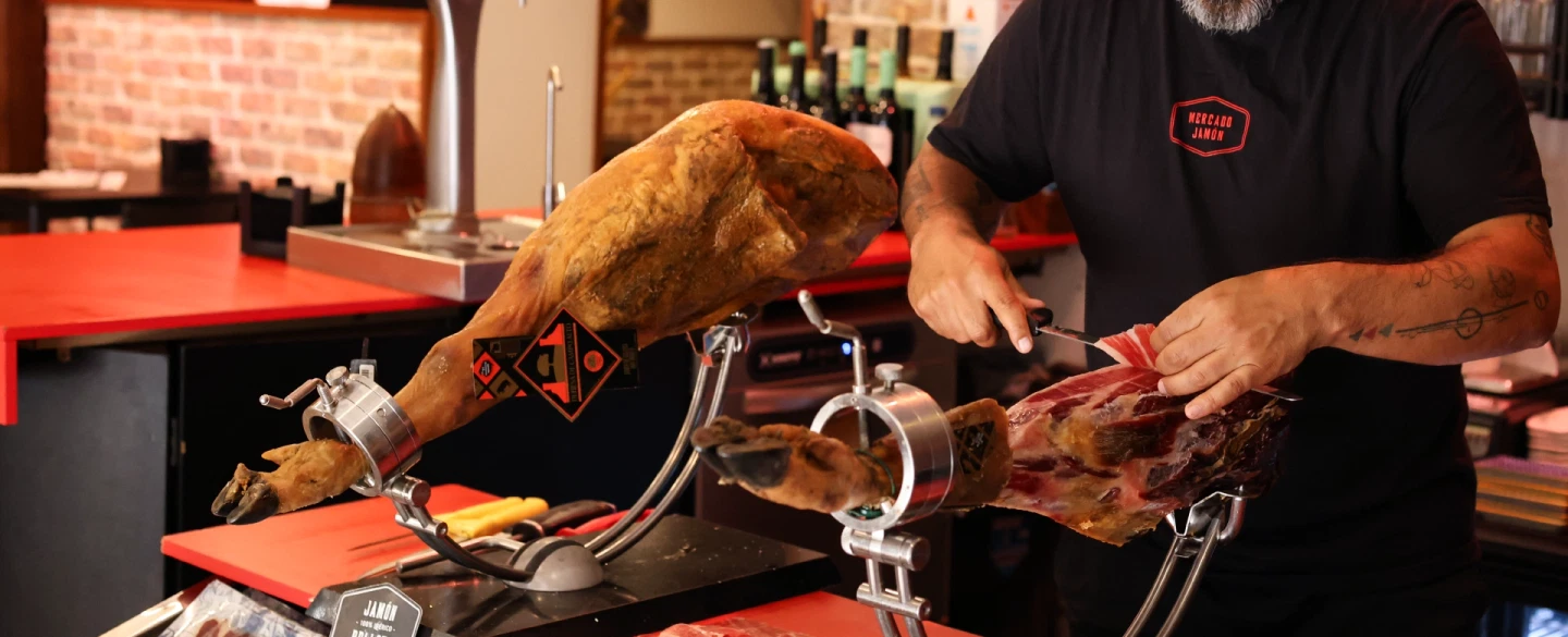 Culinary Workshop in Madrid with Iberian ham slicing, artisan cheese, and regional wine pairings.