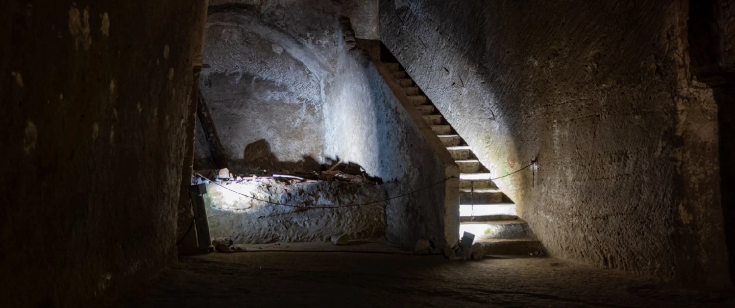 History Tour beneath Naples, walking through tunnels, aqueducts, ruins, and the city’s layered past.