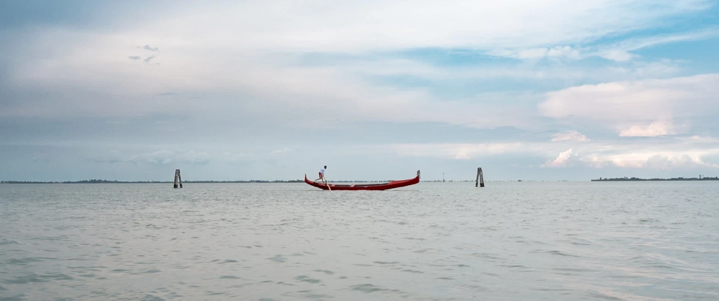 Boat Tour in Venice, savoring the timeless beauty of the city and its surrounding islands at sunset.