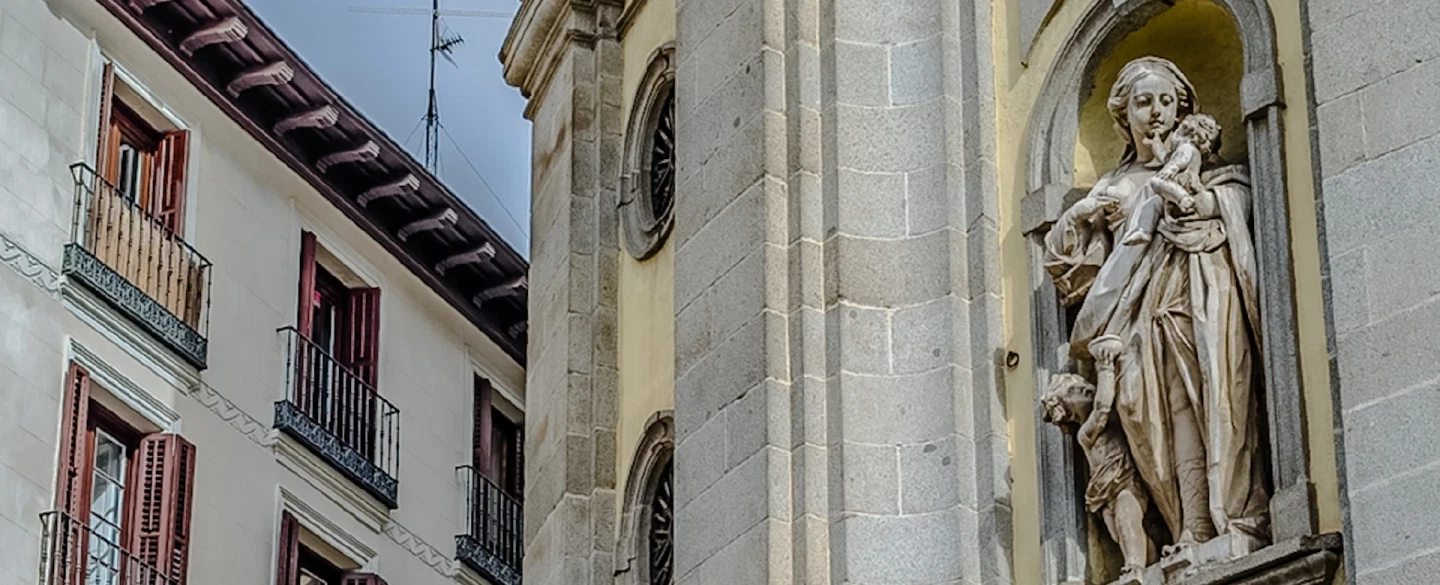 A Madrid Holy Week experience with a brotherhood host — baroque sculpture, torrija, private balcony.